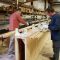 Brushing epoxy on mast staves