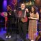 Dennis Pitts and Patricia Rose present Rosanne Cash with her courtesy flag to fly when she sails!